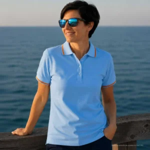 Polo celeste mujer con bandera de España en cuello y mangas