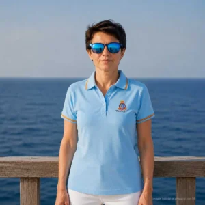 Polo Patrulla Águila celeste mujer con emblema bordado y bandera de España